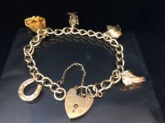 9ct Gold charm bracelet with all 9ct Gold charms including a sail boat, horse shoe, teapot, boot and