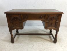 Knee hole leather topped writing desk with five drawers on turned legs with cross stretcher approx