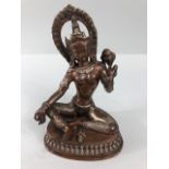 Oriental Interest, Tibetan, 2 colour metal statue of the Green Tara, sealed base possibly containing