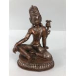 Oriental interest, Two colour metal Tibetan statue of the Green Tara, base still sealed, possibly