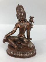 Oriental interest, Two colour metal Tibetan statue of the Green Tara, base still sealed, possibly