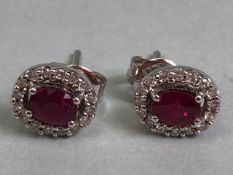 Ruby and Diamond Stud earrings set in 9ct white Gold