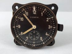 Military interest, WW2 German aircraft clock by KIENZLE, opening brass case, movement inside stamped