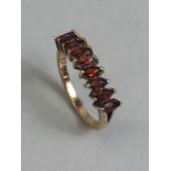 9ct yellow gold ring set with 9 bohemian marquee cut Garnets size K, approximately 2.14 g