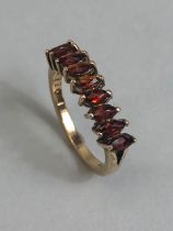 9ct yellow gold ring set with 9 bohemian marquee cut Garnets size K, approximately 2.14 g