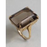 9ct Gold Smokey Quartz ring, the large rectangular Quartz stone set with four claws, the stone