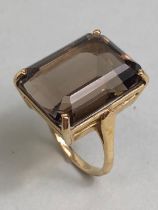 9ct Gold Smokey Quartz ring, the large rectangular Quartz stone set with four claws, the stone