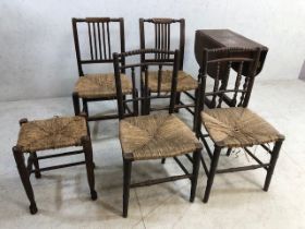 Collection of four rush seated chairs and a similar stool accompanied by a small oak drop leaf table
