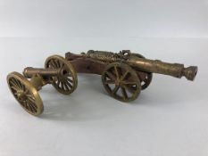 Military Interest, 2 Decorative brass cannons the larger on a wooden carriage