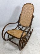 Wooden bent wood rocking chair with cane seat and back