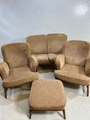 Ercol three piece suite and matching Ercol footstool consisting two seater sofa and two armchairs,