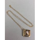 Square pendant set with central stones on a fine 9ct Gold necklace (approx 44cm in length