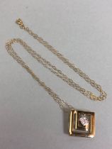 Square pendant set with central stones on a fine 9ct Gold necklace (approx 44cm in length