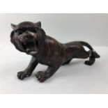 Patinated Brass sculpted figure of a roaring Tiger approximately 29cm in length