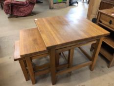 Modern light oak nest of three stacking tables. Approx 60 x 60 x 56cm