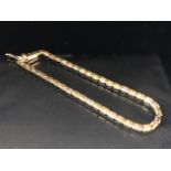 9ct gold bracelet with hollow pierced square form links approx 18cm in length and 3.6g