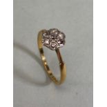 18ct Gold Flower head ring set with Diamonds in a star configuration size 'O'
