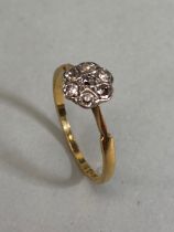 18ct Gold Flower head ring set with Diamonds in a star configuration size 'O'