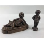 bronze figures, 2 small figures one of a recumbent girl, approximately 10cm long the other of the