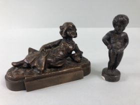 bronze figures, 2 small figures one of a recumbent girl, approximately 10cm long the other of the
