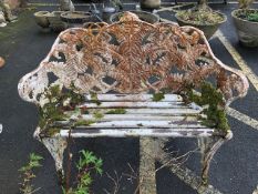 Wooden slatted ornate garden bench with fern design