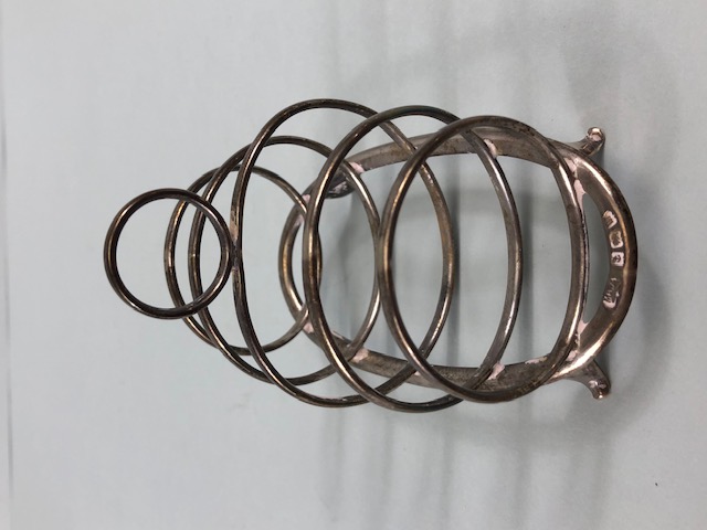 Hallmarked silver toast rack with graduated circular dividers on oval base with four splayed feet - Image 2 of 4