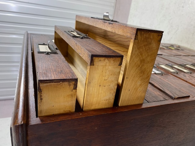 Dark stained oak specimen cabinet with two flights of 14 narrow drawers with metal cup handles - Image 11 of 13