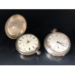 Two Silver pocket watches the larger stamped OMEGA inside back cover (winds and runs) the other