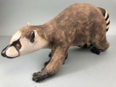 Pottery sculpture , a naturalistic art sculpture of a ring tailed lemur approximately 39 x 19 cm (