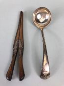 Hallmarked silver ladle approx 18cm in length and 78g along with a pair of Ebony glove stretchers