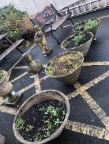 Four concrete conical garden planters