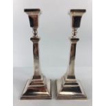 Pair of Hallmarked Silver candlesticks on stepped bases with applied beading each approx XX cm