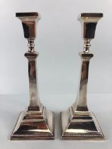 Pair of Hallmarked Silver candlesticks on stepped bases with applied beading each approx XX cm