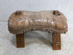 Leather seated camel stool with stud work detailing and bell