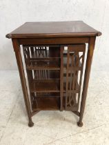 Large table/canterbury on octagonal legs with rotating book shelf to centre, approx 60cm x 60cm x