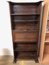 Arts and crafts bureau bookcase with fall front to reveal writing slope and pigeon holes with