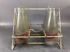Local interest: set of four vintage glass milk bottles from East Devon Dairies, Honiton and Ottery