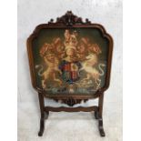 Antique furniture, later Victorian fire screen of carved flame mahogany on legs with a glazed