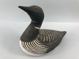 Pottery sculpture, a naturalistic art sculpture of a Guillemot in unglazed pottery approximately