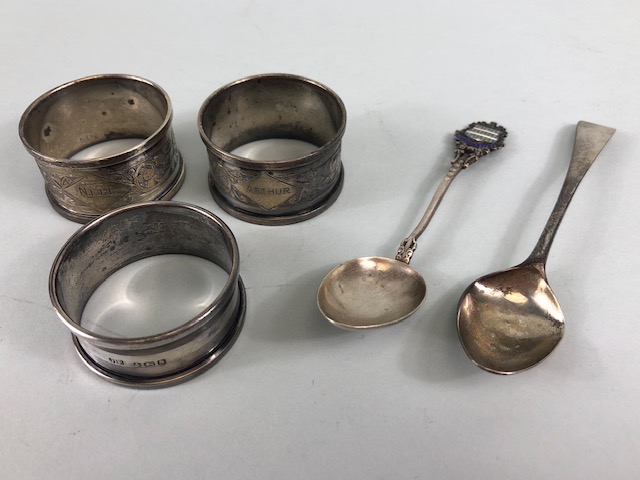 Collection of silver items to include Three Hallmarked silver napkin rings and two silver spoons (
