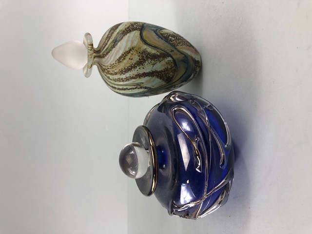 studio art glass, two hand blown sent bottles, one of blue glass with bronze and silver raised glass