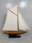 Large contemporary model of a sailing yacht, on rectangular ebonised base, approx 100cm in height