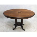 Edwardian oval ocassional table on four column support qith splayed legs and inlay marketry