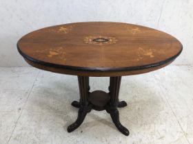 Edwardian oval ocassional table on four column support qith splayed legs and inlay marketry