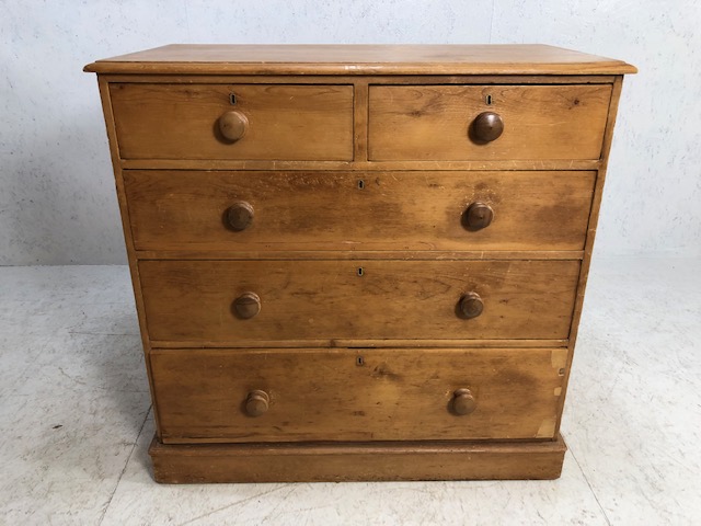 Pine chest of five drawers with turned handles. approx 105cm x 55cm x 104cm