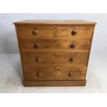 Pine chest of five drawers with turned handles. approx 105cm x 55cm x 104cm