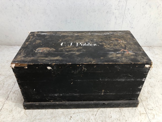 Black painted pine trunk with metal handles to side and plinth to base, approx 95cm x 51cm x 48cm