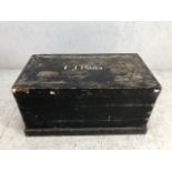 Black painted pine trunk with metal handles to side and plinth to base, approx 95cm x 51cm x 48cm