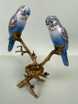 Bronze and porcelain candle holder of 3rd empire style being a pair of Budgerigars sat on a branch