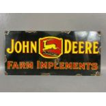 Advertising signs, enamel and metal sign for John Deere Farm Implements approximately 45 x 21 cm